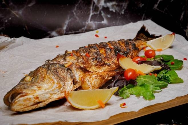 Branzino Whole Fish on Grill.